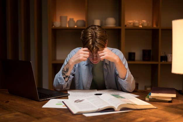 Free photo young man learning in a virtual classroom