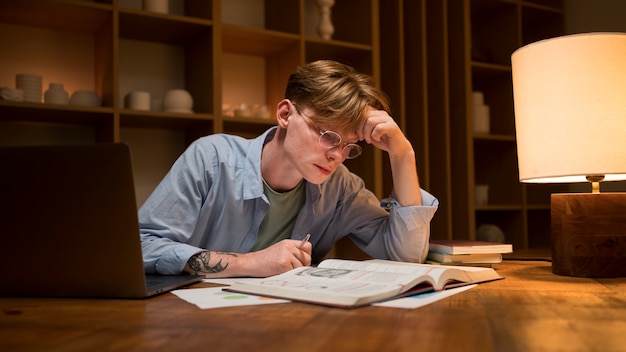 Young man learning in a virtual classroom