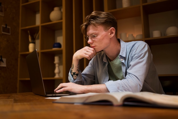 Young man learning in a virtual classroom