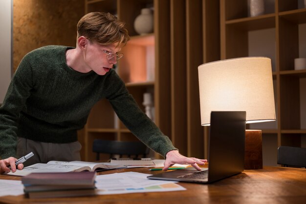 Young man learning in a virtual classroom