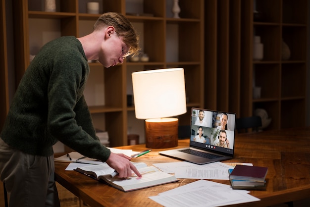 Young man learning in a virtual classroom