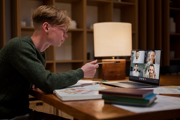 Young man learning in a virtual classroom