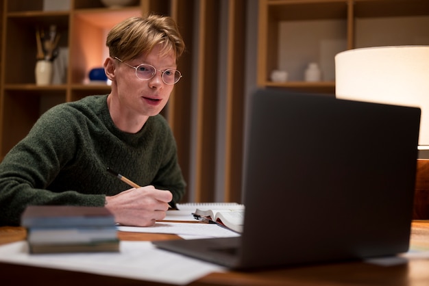 Young man learning in a virtual classroom