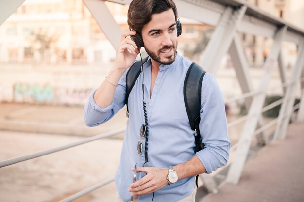 Young man listening to music on headphone