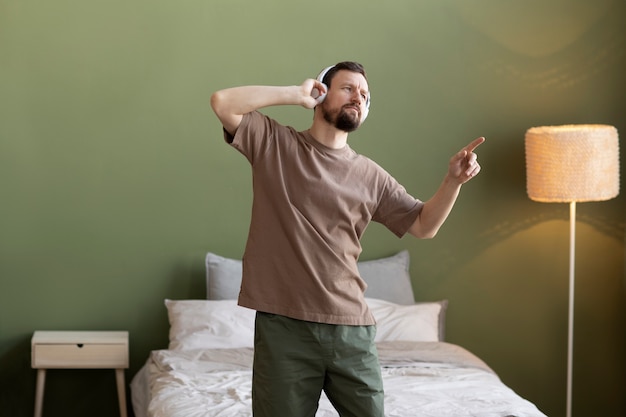 Free photo young man listening to music