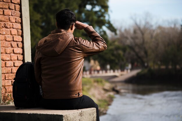 Young man looking away outdoors