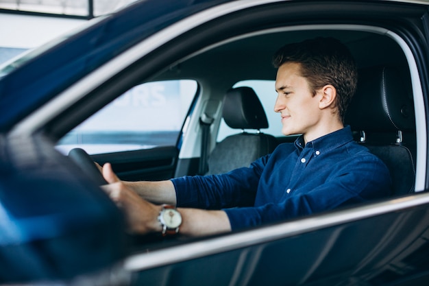 Young man looking for a car to rent