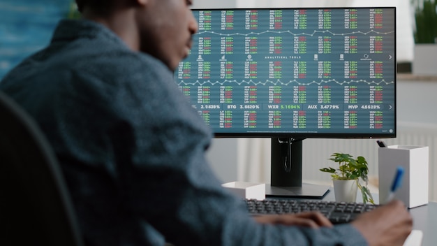 Young man looking into crypto currency stock market