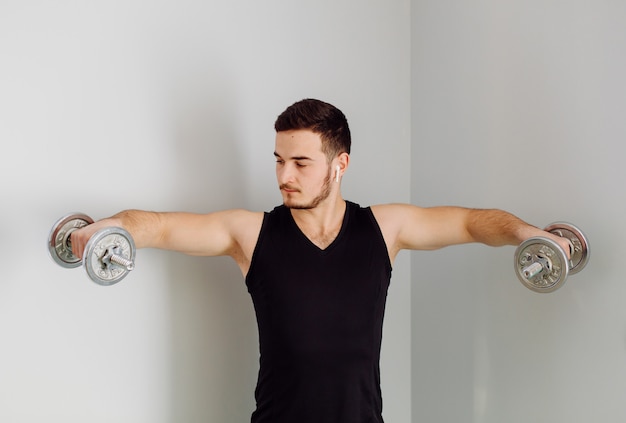 Free photo young man making sport exercises at home