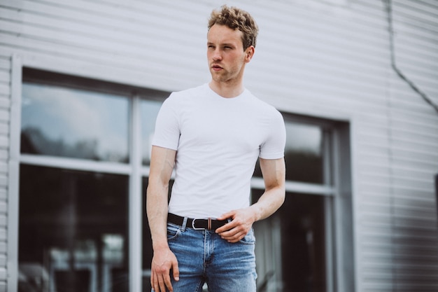 Young man model posing in the street