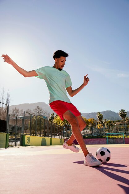 Young man playing football