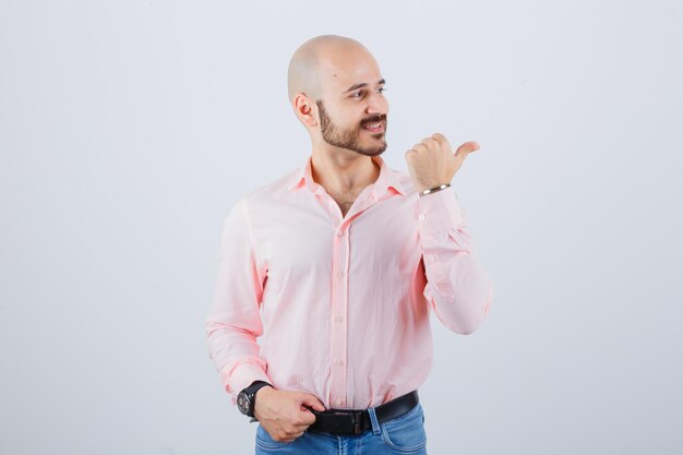 Young man pointing to the right side