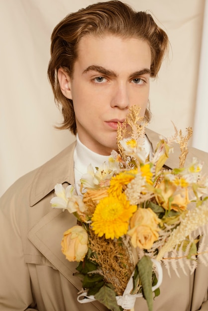 Young man portrait with flowers