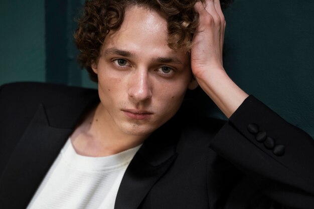 Young man posing indoors medium shot