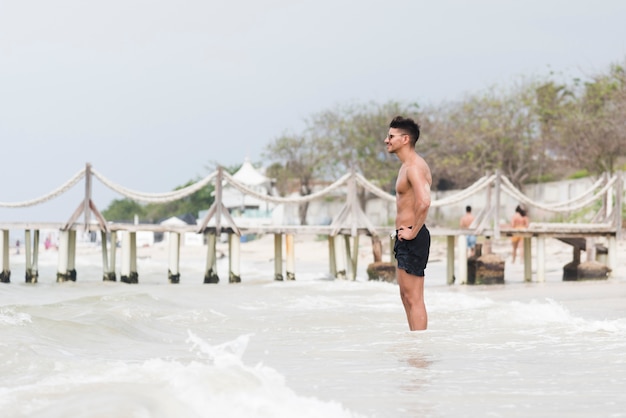 Young man relaxing at the seaside