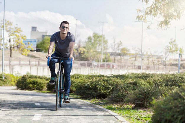 Young man riding bike