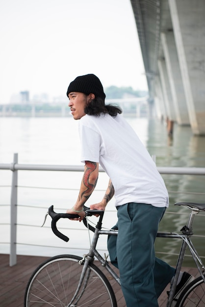 Young man riding his bike