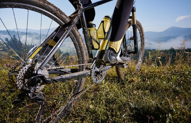 Young man riding a mountain bike downhill style