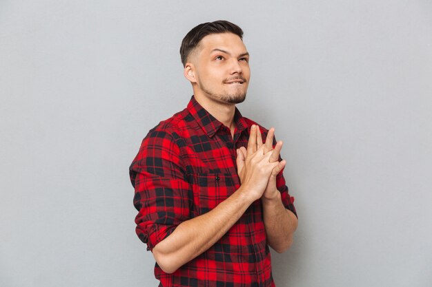 Young man in shirt posing in studio