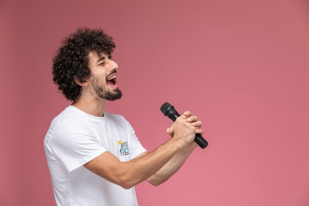 young man singing with his head voice