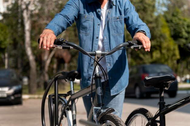 Young man spending time outside with his bike