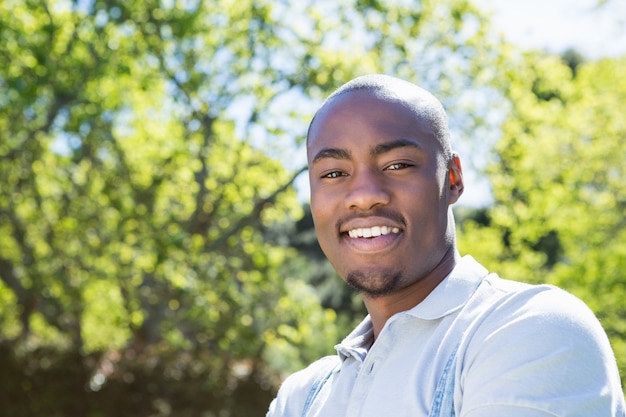 Young man standing in garden