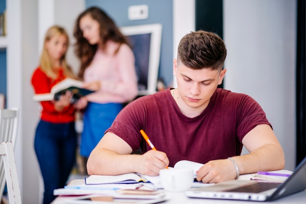 Free Photo young man studying at table