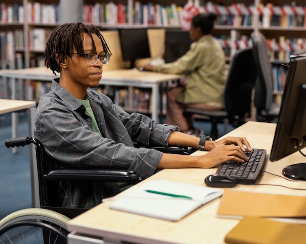 Young man studying in the university library