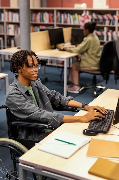 Young man studying in the university library