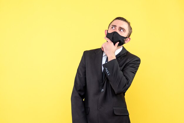 Young man in suit brainstorming