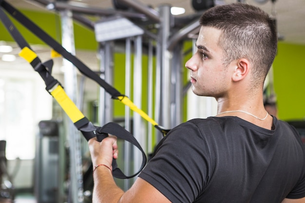 Free photo young man training in the gym