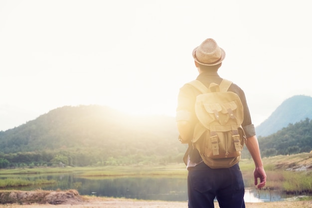 Free Photo young man traveler with backpack relaxing outdoor.