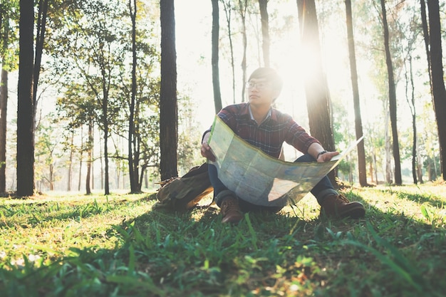 Free Photo young man traveler with backpack relaxing outdoor.