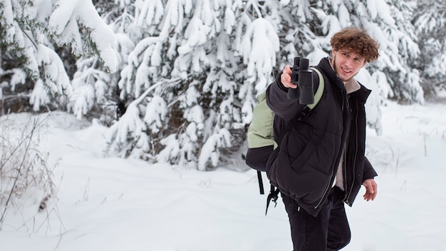 Young man traveling in winter time