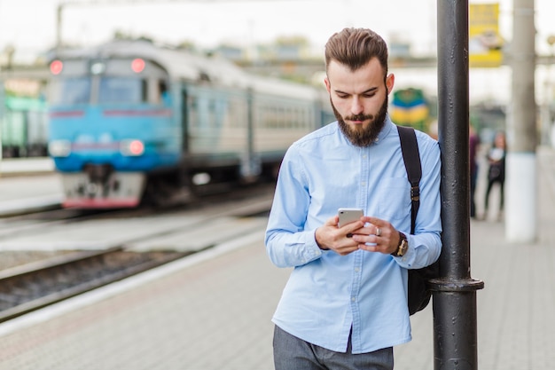 Young man using cellphone at outdoors