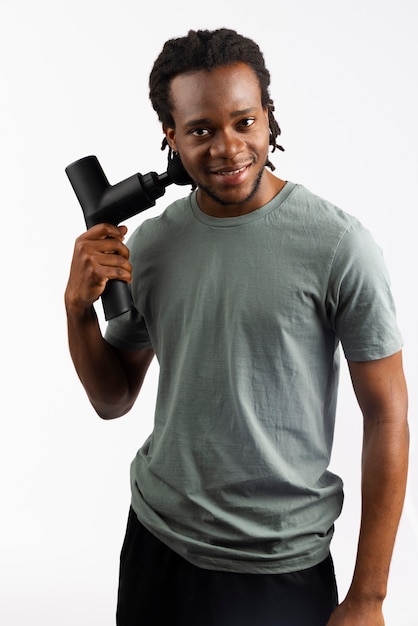 Young man using message gun