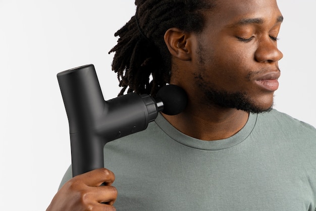 Young man using message gun