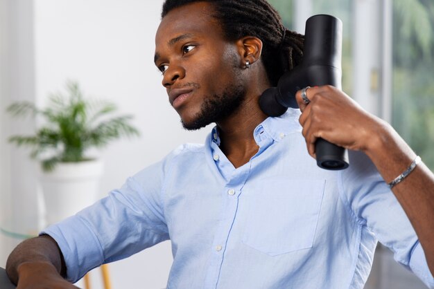 Young man using message gun