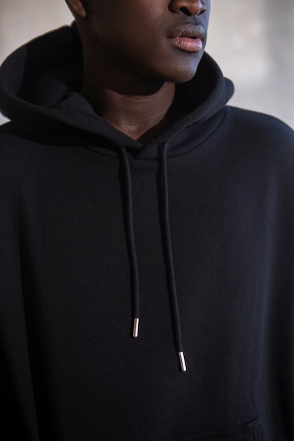 Free Photo young man wearing black hoodie