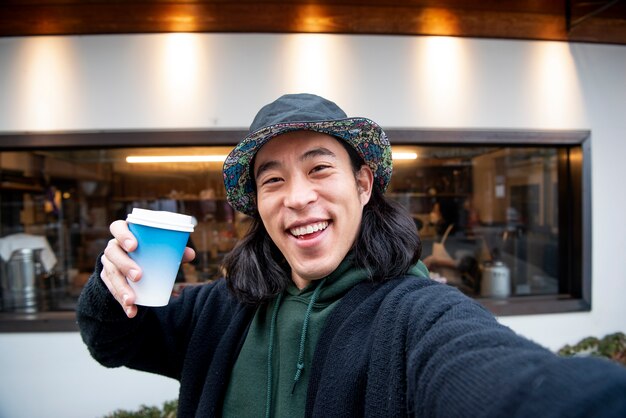 Young man wearing a bucket hat in the city