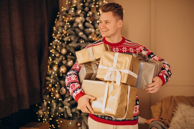 Young man with Christmas presents