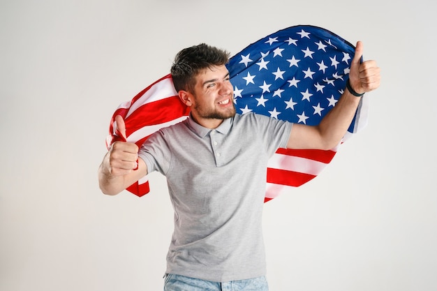 Free photo young man with the flag of united states of america