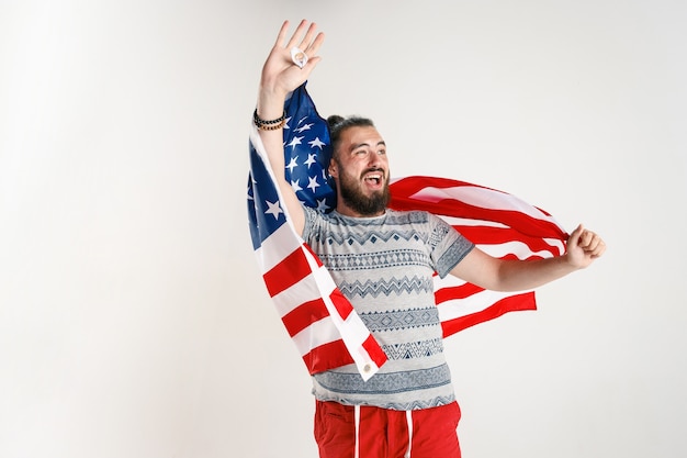 Free Photo young man with the flag of united states of america