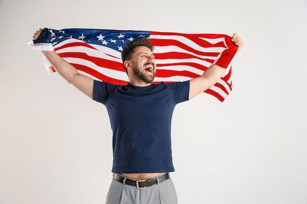 Free photo young man with the flag of united states of america