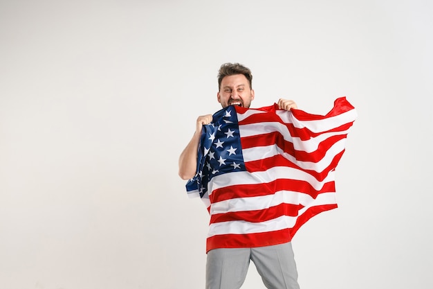 Free Photo young man with the flag of united states of america