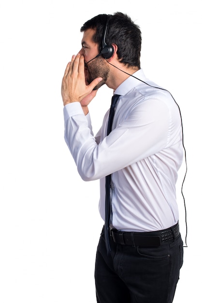 Young man with a headset shouting