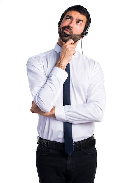 Young man with a headset thinking