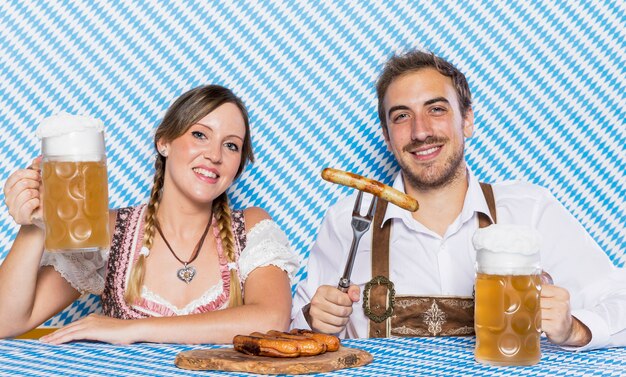 Young man and woman celebrating oktoberfest