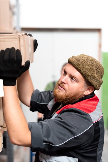 Free photo young man working in a warehouse