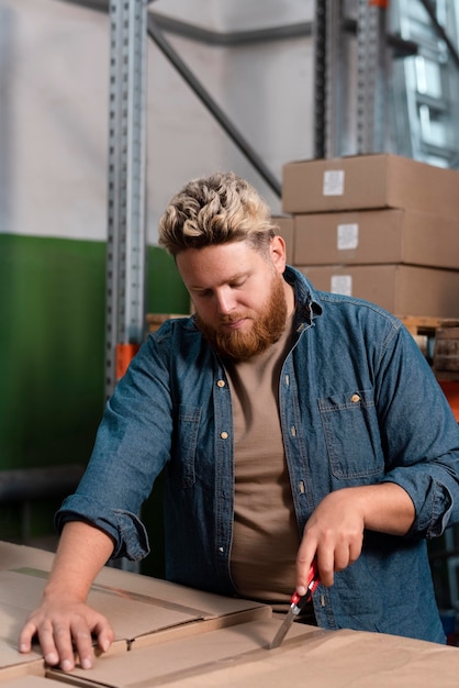 Free photo young man working in a warehouse